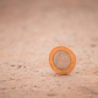 silver and gold round coin