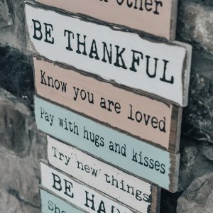 white and brown wooden signage