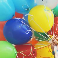 person holding balloons